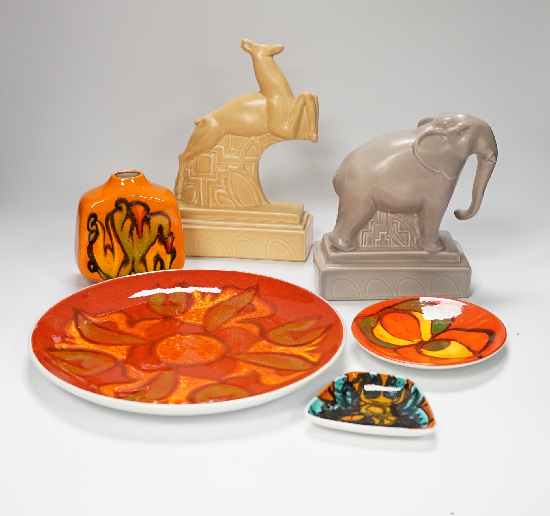Four Poole Pottery Delphis items including a small vase, a plate, etc. and two animals stamped Poole, plate 25cm (6)